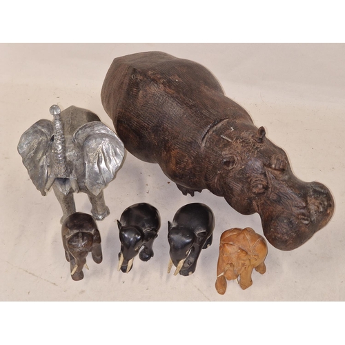 147 - Mixed size carved African Elephants to include a large metal item together a carved Hippo