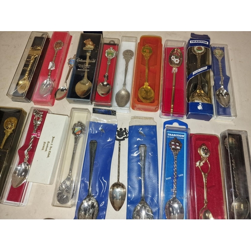 548 - Collection of Tourism spoons to include silver and a silver bookmark