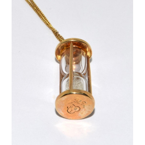 317 - 9ct gold necklace pendant set as an egg timer