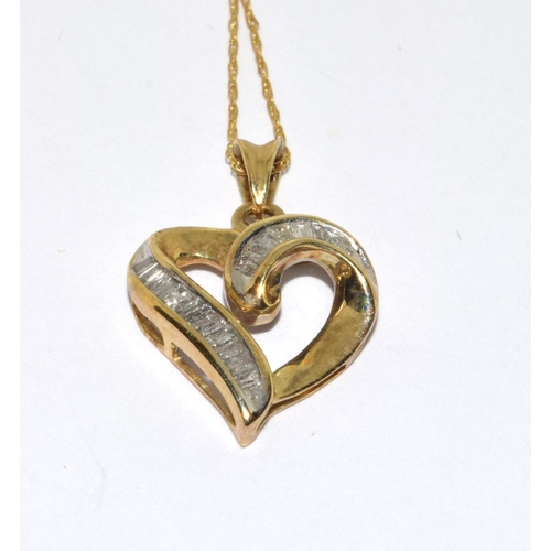 202 - 9ct gold heart pendant necklace set with Baggett diamonds