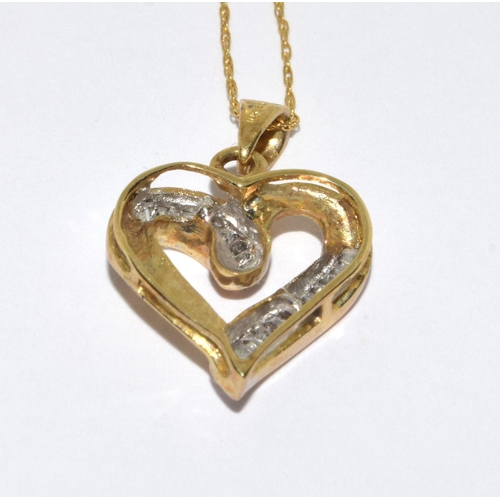 202 - 9ct gold heart pendant necklace set with Baggett diamonds