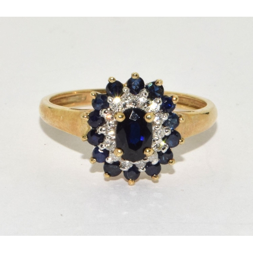 258 - 9ct gold ladies Diamond and Sapphire cluster ring size P