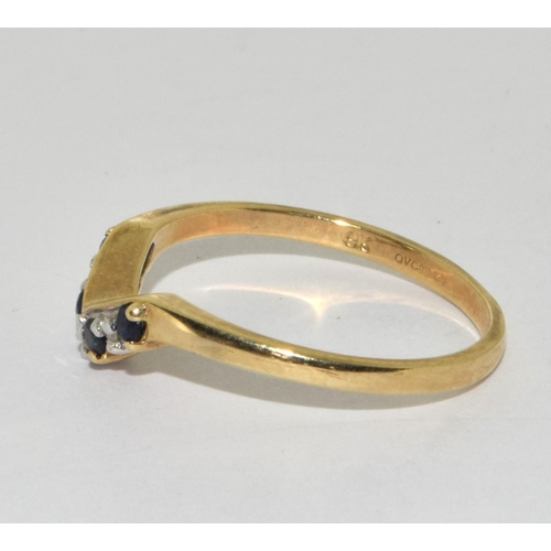 195 - 9ct gold ladies V shape Diamond and sapphire ring size O