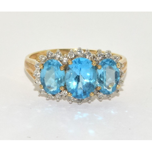 192 - 9ct gold ladies Diamond and Triple Blue Topaz ring size S