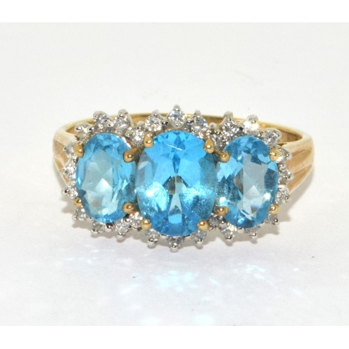 192 - 9ct gold ladies Diamond and Triple Blue Topaz ring size S