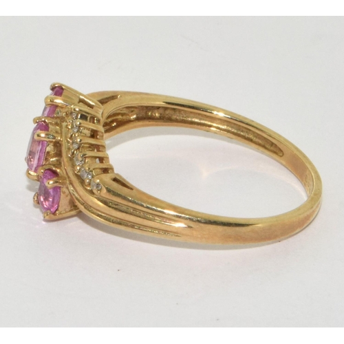 194 - 9ct gold ladies Diamond and Pink Tourmaline twist ring size Q