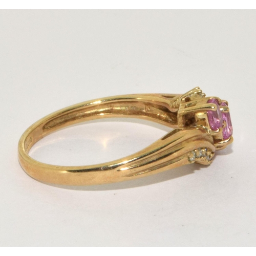 194 - 9ct gold ladies Diamond and Pink Tourmaline twist ring size Q