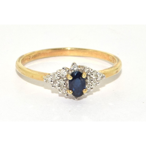 198 - 9ct gold ladies Diamond and Sapphire cluster ring size O