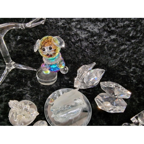 78 - A quantity of Swarovski glass items to include animals.