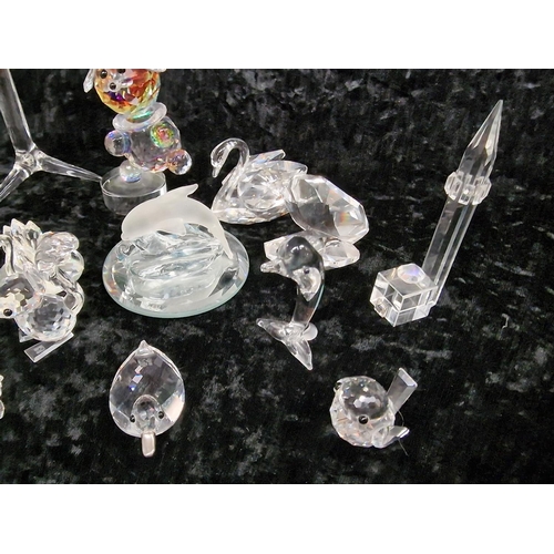 78 - A quantity of Swarovski glass items to include animals.