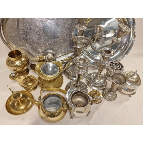 185 - Collection of silver plated and brassware items to include serving trays and candlesticks.