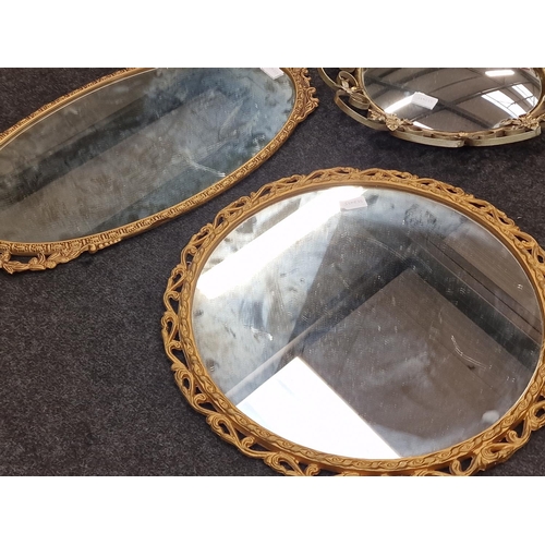 81 - Three vintage gilded wall mirrors of varying sizes.