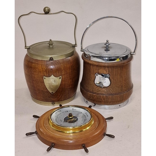 82 - Two vintage wooden biscuit barrels together with a wooden ships wheel barometer (3).