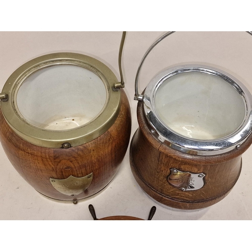 82 - Two vintage wooden biscuit barrels together with a wooden ships wheel barometer (3).