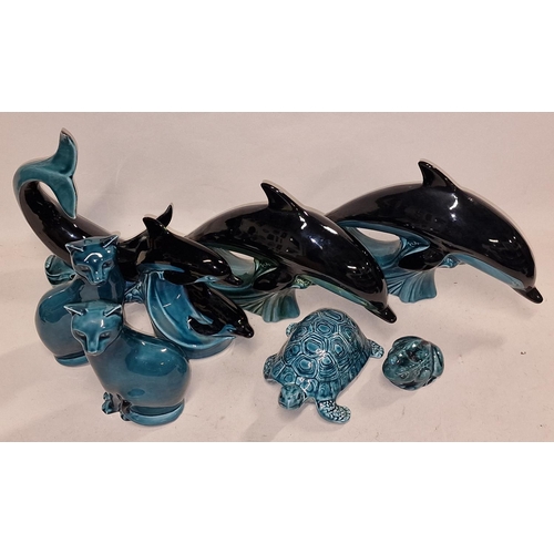 97 - Poole Pottery collection of blue glazed animals to include Dolphins, Cats, Frog etc (8).