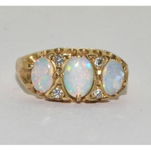 358 - 9ct gold ladies 3 stone Fire Opal and Diamond ring size M