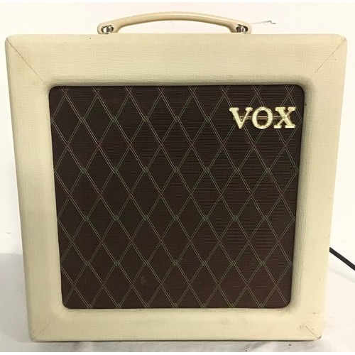 527 - VOX GUITAR AMPLIFIER. This is model No. AC4TV and powers up when plugged in.