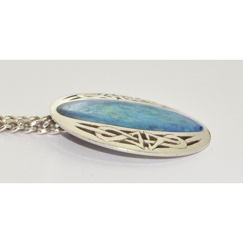 207 - A silver blue enamel fish pendant fully hallmarked on silver chain.