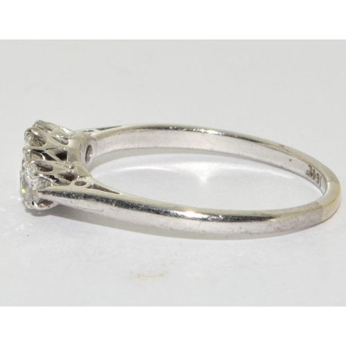 386 - A Diamond 3 stone ring centre approx. 0.50 point sides approx 0.25 each total approx 1.00ct set in 1... 