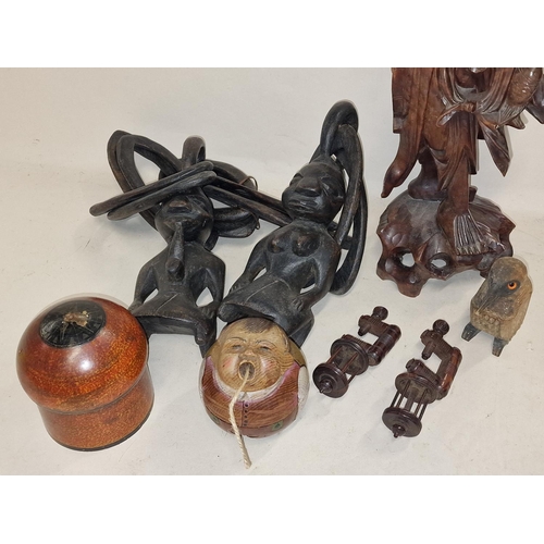 106 - Collection of wooden/treen items to include wool winder and carved figural lamp (7).