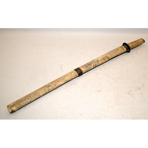 130 - A vintage Japanese short sword with carved bone scabbard and handle. O/all length 63cms