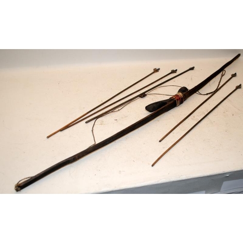 131 - 2 x vintage African Tribal swords c/w vintage bow and arrows