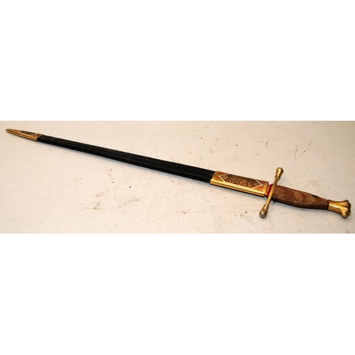 158 - Decorative sword with brass crosspiece and wooden handle c/w leather and brass scabbard