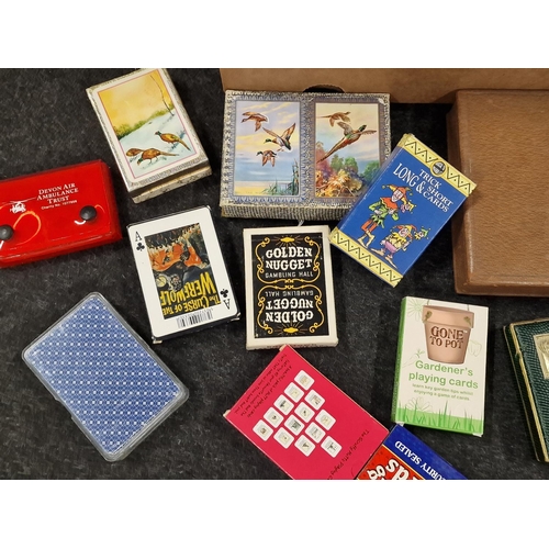 407 - Box containing a large collection of vintage and modern playing cards. Some collectable sets include... 