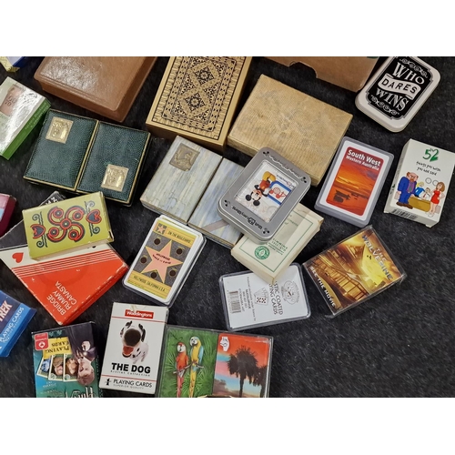 407 - Box containing a large collection of vintage and modern playing cards. Some collectable sets include... 