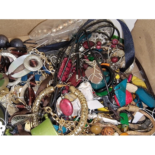 480A - A box of assorted costume jewellery.