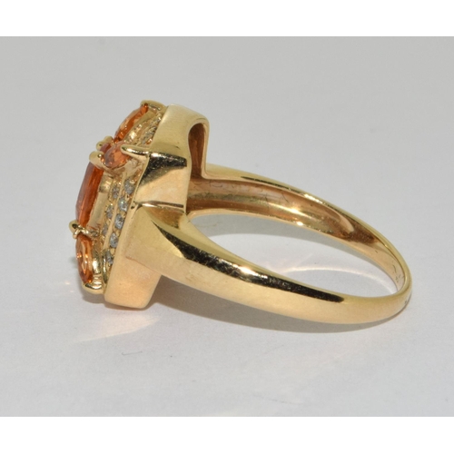 378 - A 14ct Y/G diamond and citrine cluster ring. Size O