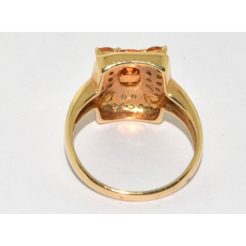 378 - A 14ct Y/G diamond and citrine cluster ring. Size O