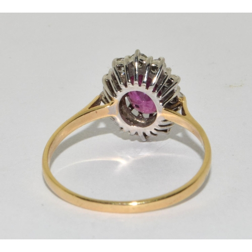 388 - An 18ct Y/G ring the central spinel surrounded bu diamonds. Size S