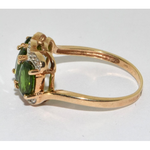 380 - A Y/G tourmaline and diamond ring. Size P