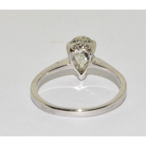 387 - An 18ct W/G pear shaped Diamond ring. Size M