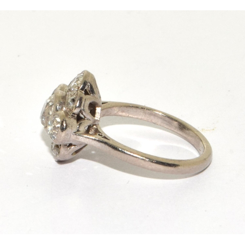 390 - An 18ct W/G Diamond flower shaped cluster ring. Size K