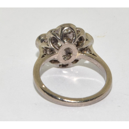 390 - An 18ct W/G Diamond flower shaped cluster ring. Size K