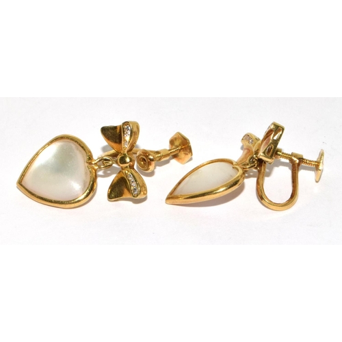 374 - A pair of Y/G heart shaped diamond and mother of pearl drop earrings.