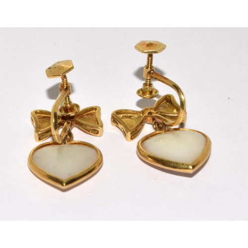 374 - A pair of Y/G heart shaped diamond and mother of pearl drop earrings.