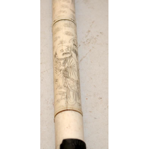 32 - Antique carved bone opium pipe  decorated with Oriental figures. O/all length 50cms