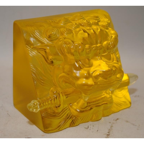 490 - Quality Chinese pressed glass paperweight in opaque golden colour featuring a Dog of Fo with a sword... 