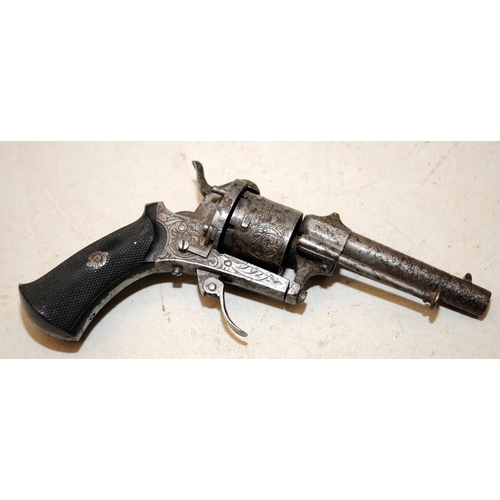 168 - Antique Six chamber revolver with functioning pull down trigger. Chamber rotates intermittently. Cer... 