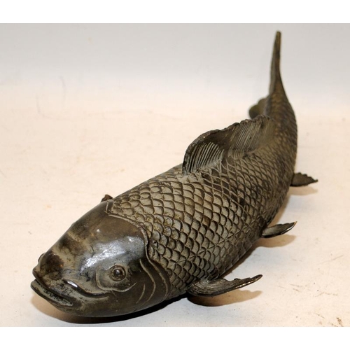 513 - Large Oriental bronze carp. 29cms across