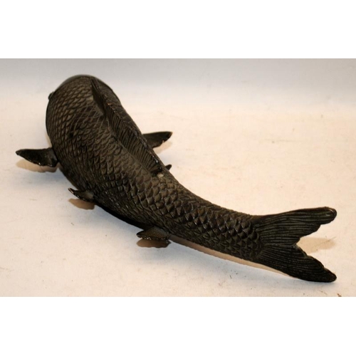 513 - Large Oriental bronze carp. 29cms across