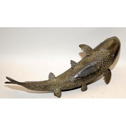 513 - Large Oriental bronze carp. 29cms across