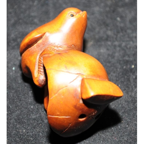 515 - Wood carved Japanese Netsuke of a chick climbing from a shell