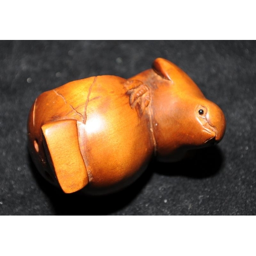 515 - Wood carved Japanese Netsuke of a chick climbing from a shell