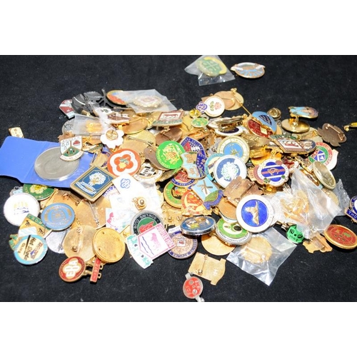 527 - Large collection of enamelled lapel badges