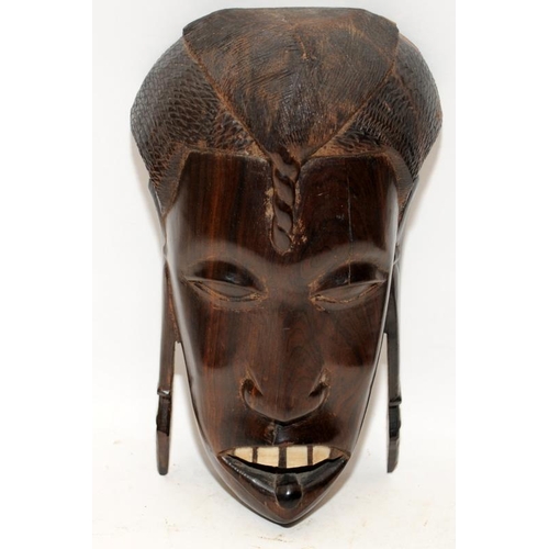 429 - Two vintage African tribal masks.The largest approx 23cms tall