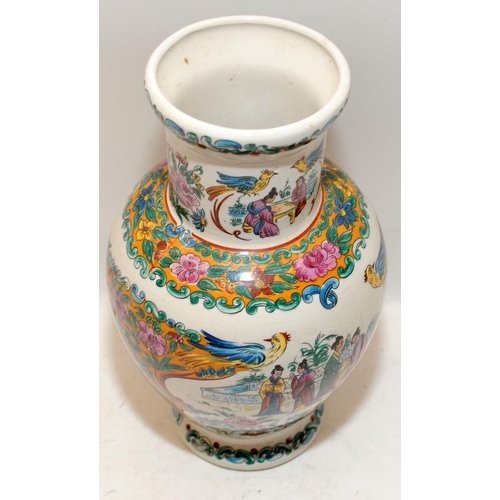 35 - Oriental vase of baluster form featuring hand painted birds in a garden scene. 23cms tall